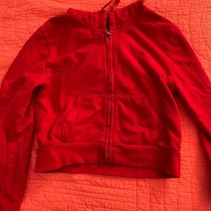 red cropped zip up